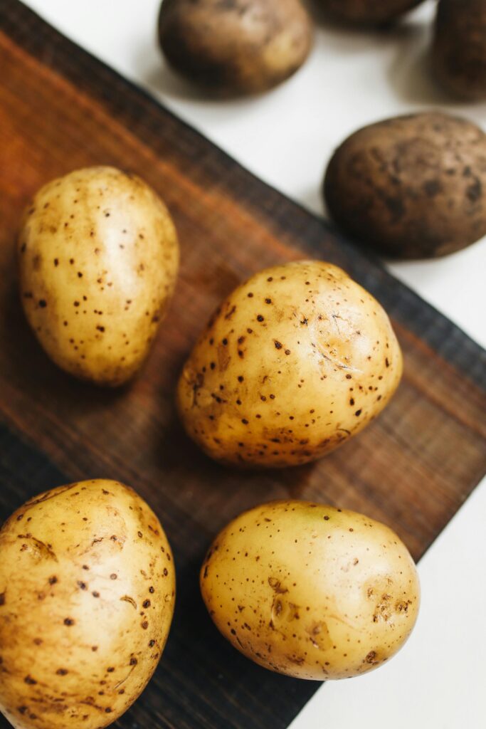 Photo Of Potato On Wooden Surface